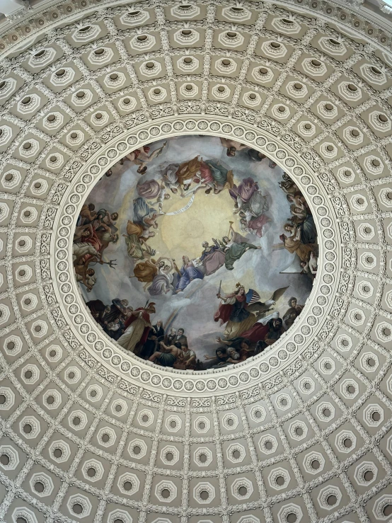 a white ceiling with paintings painted on it