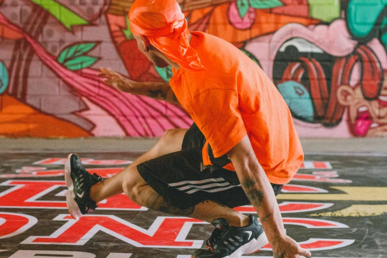 the man is performing a trick on a skateboard