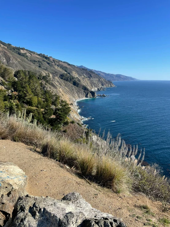 an image of a view of the ocean from top of a mountain