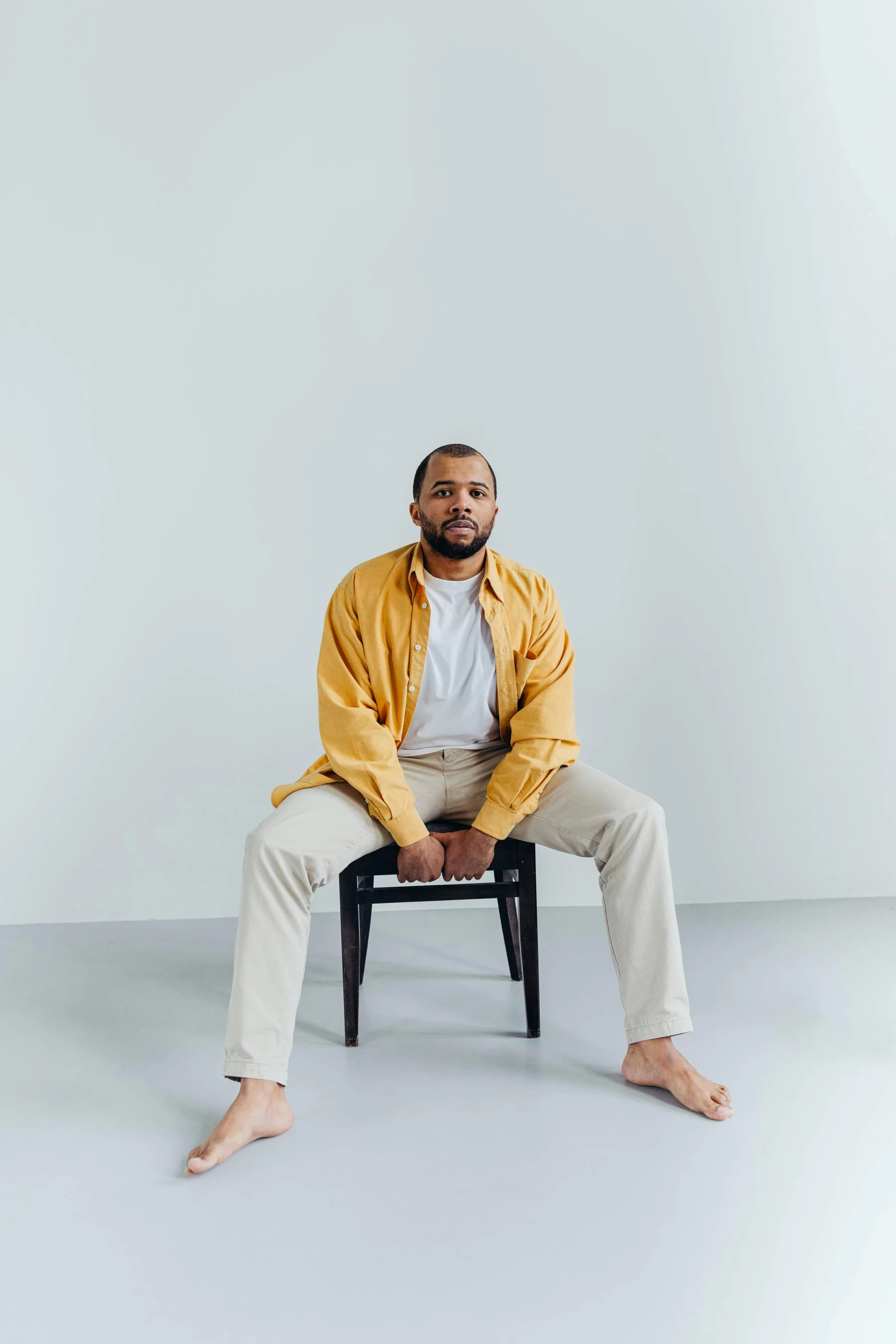 an african american man seated on a chair