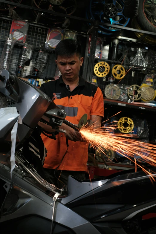 a man working on an engine in a garage