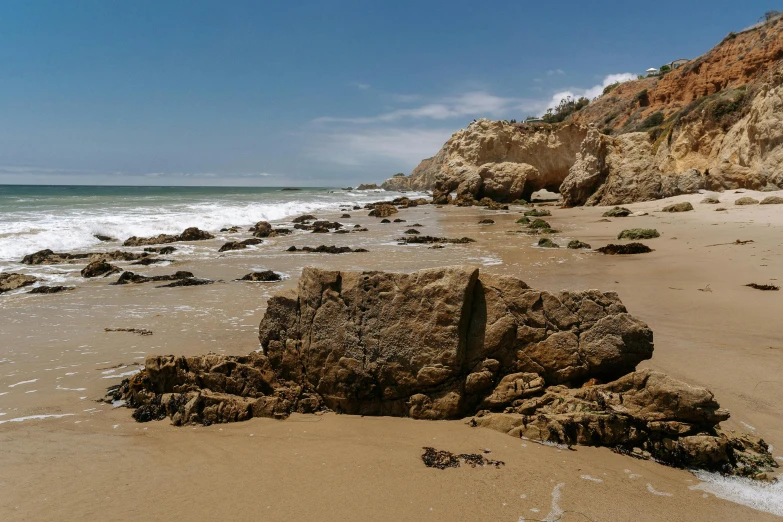 a rocky beach area on a sunny day