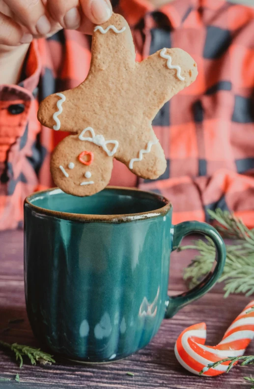 the gingerbread man is holding his cookie in his hand