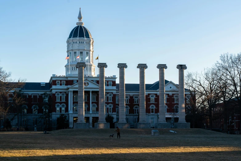 a tower on a building surrounded by columns