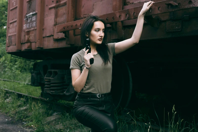 a woman leaning against the side of a train