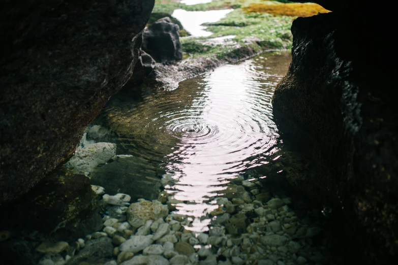 a large creek running through a rock formation