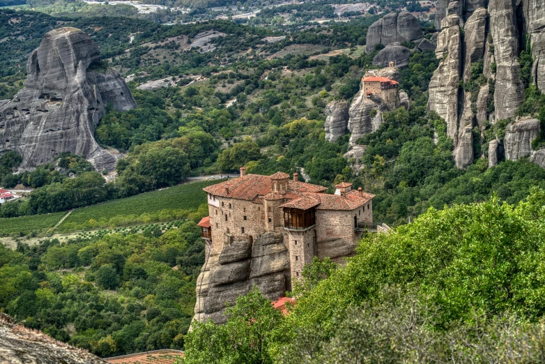 a scenic rocky valley with many towers in the mountains