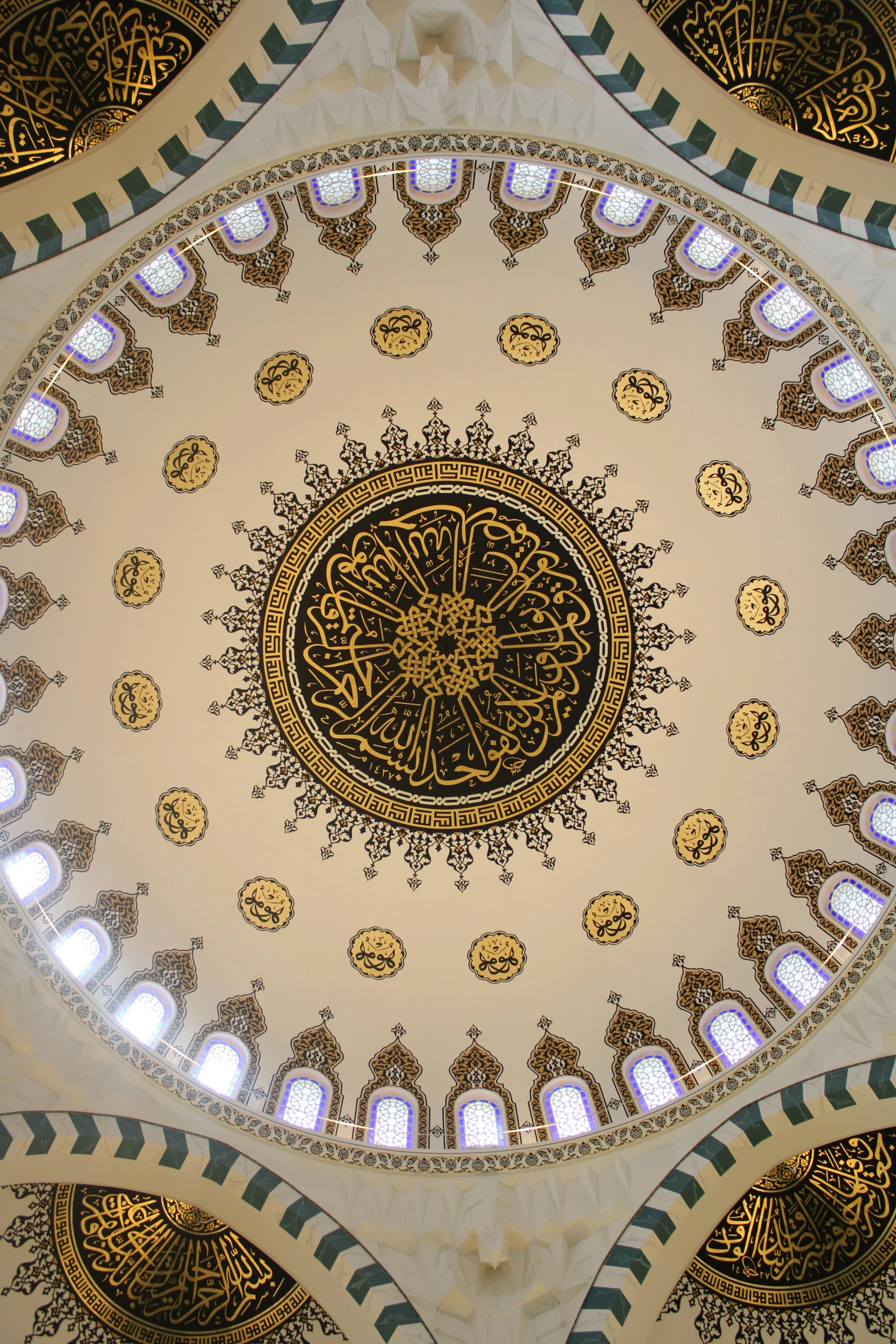 the circular ceiling of the building has a uniquely intricate design