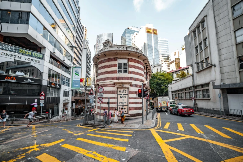 a circular structure painted red on the middle of a street