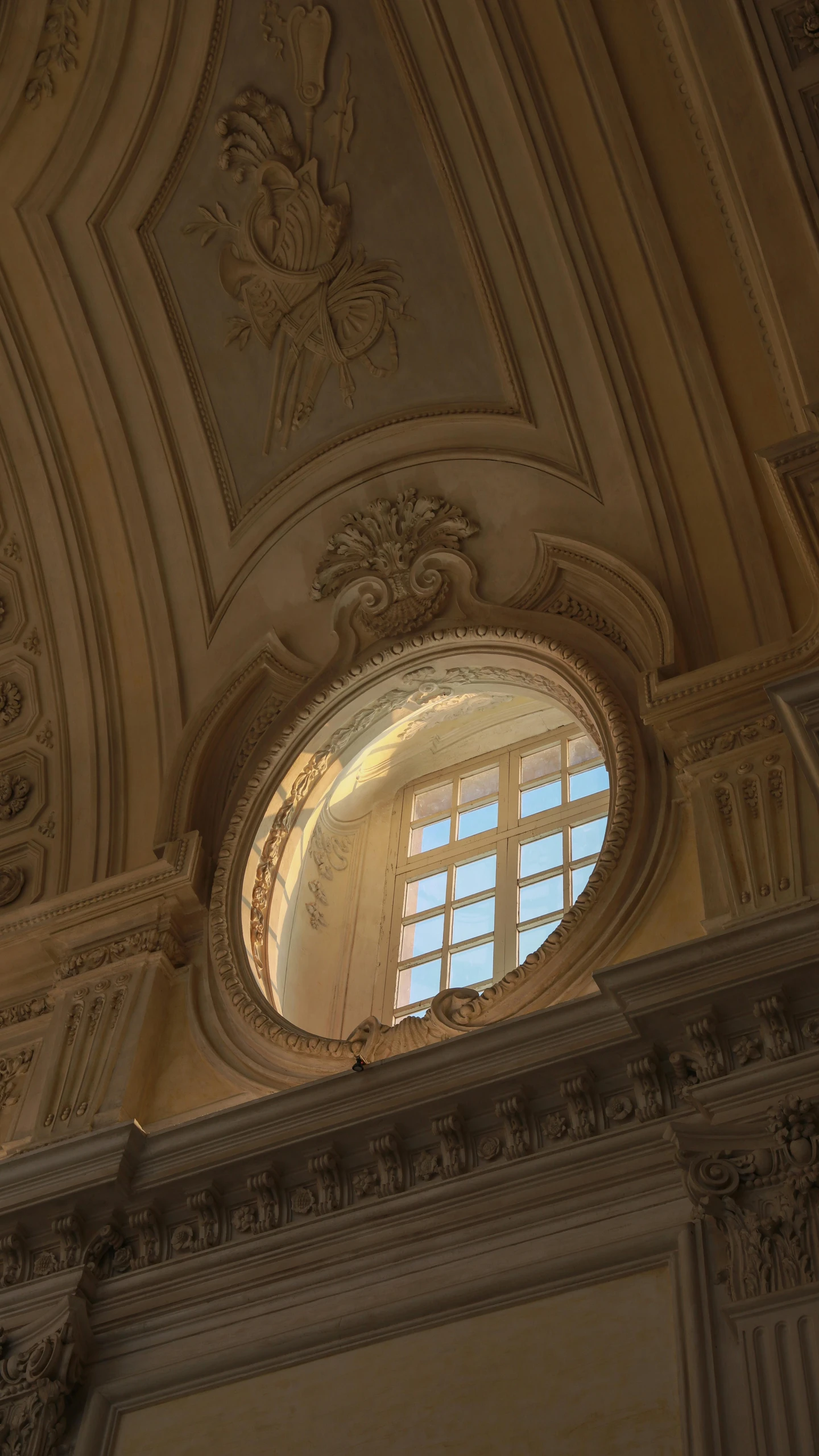 a ceiling and window in a large building