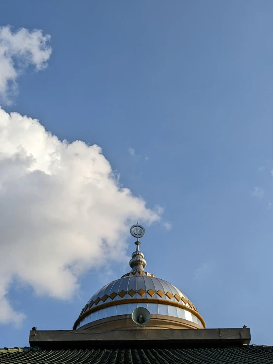 the top of a roof and a sky background