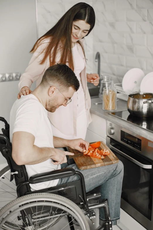 a woman  up a piece of food on top of a wooden board