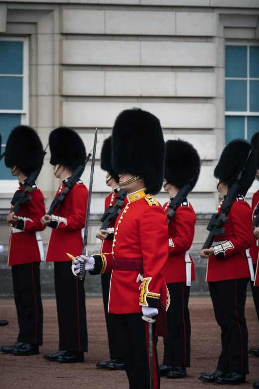 an image of men in uniform marching at ceremony