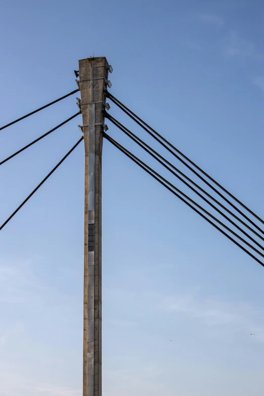 an electrical pole with many electric wires above it