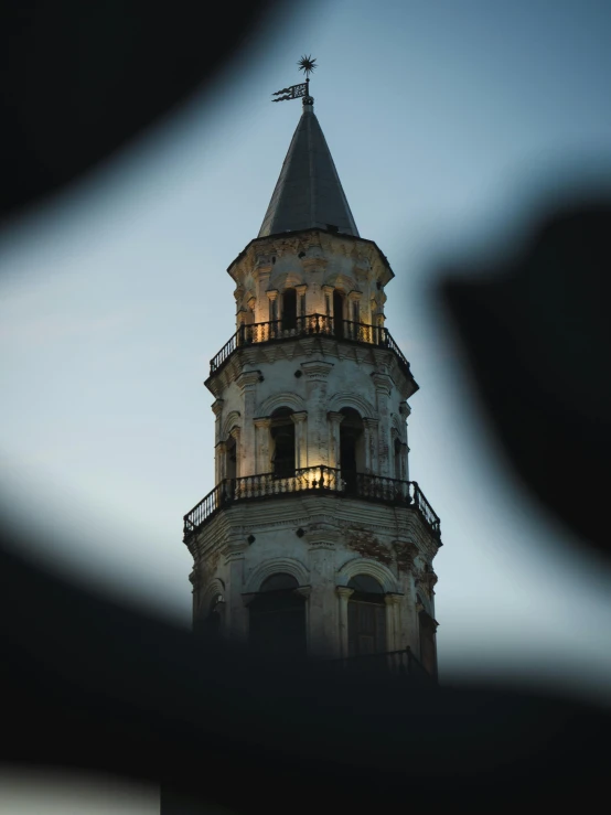 a very tall white building with a clock tower