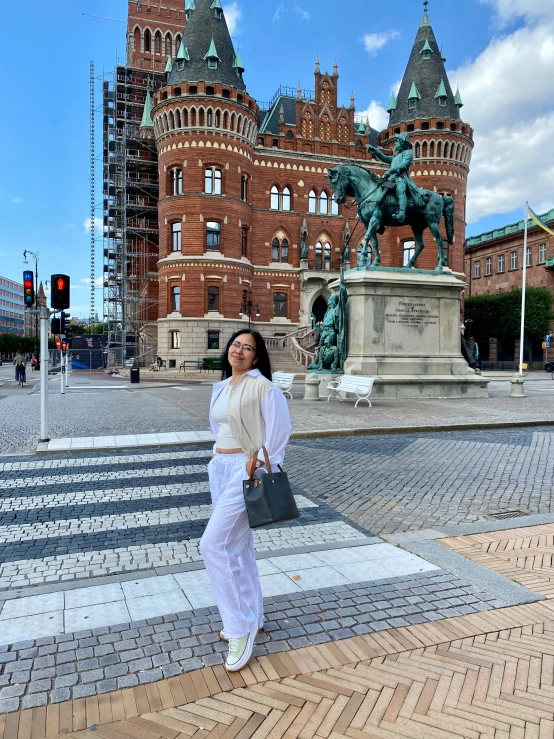 an asian woman in white walking down the street