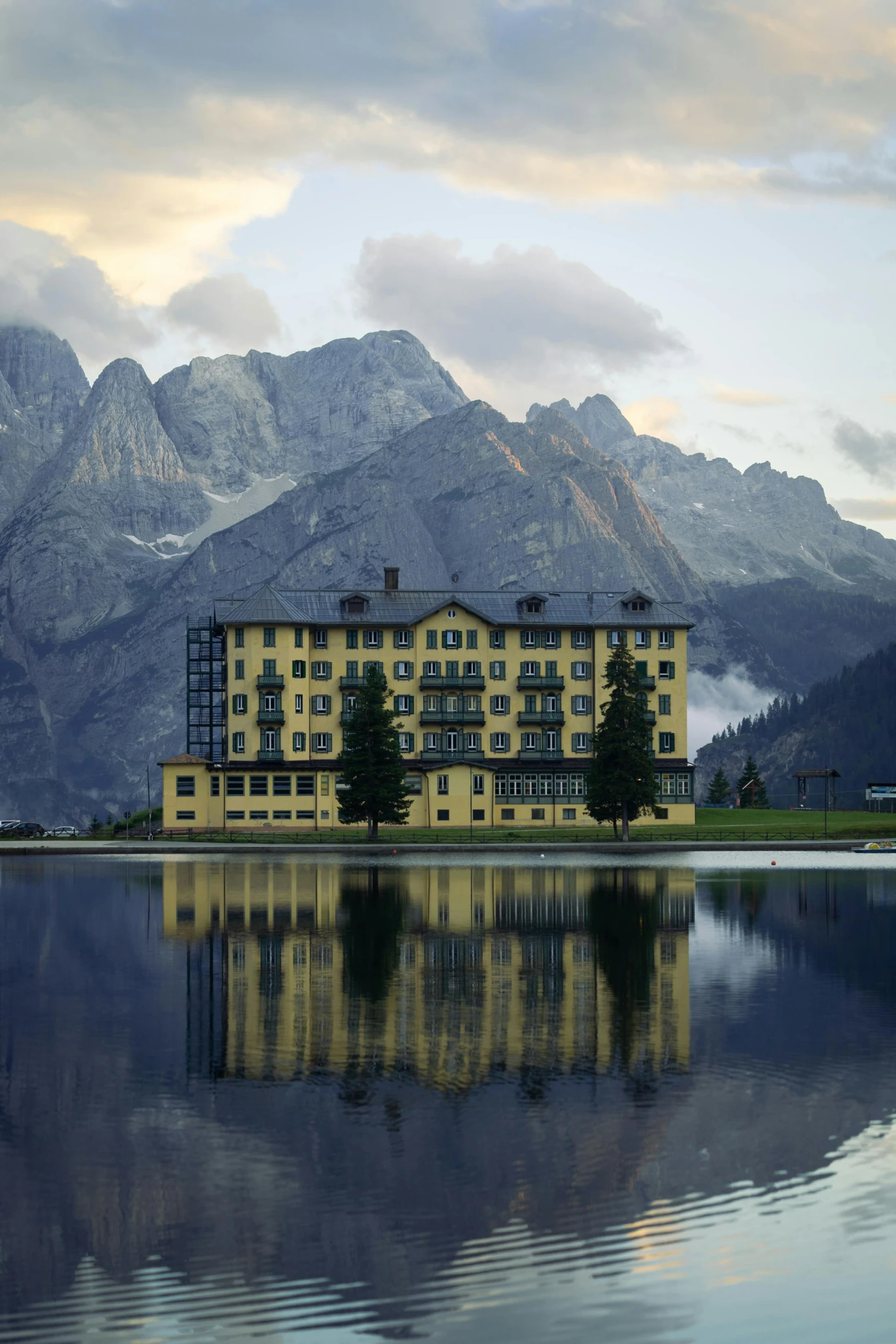 the resort is nestled between two mountains and a lake