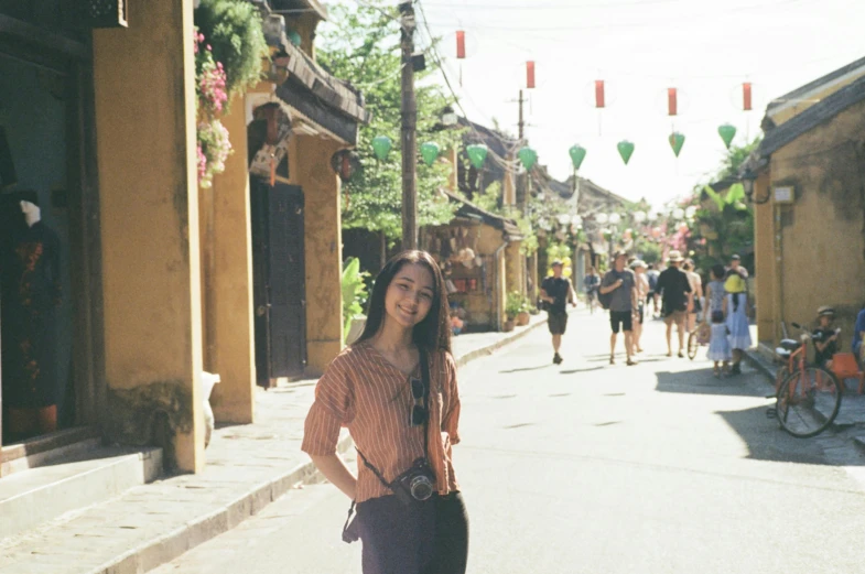 the girl is standing in the street with her hands on her hips