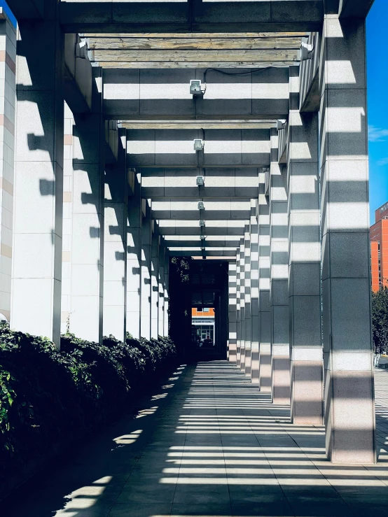 a long white and grey structure on a sunny day