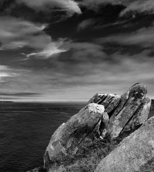 rock formations on the horizon and ocean are dramatic