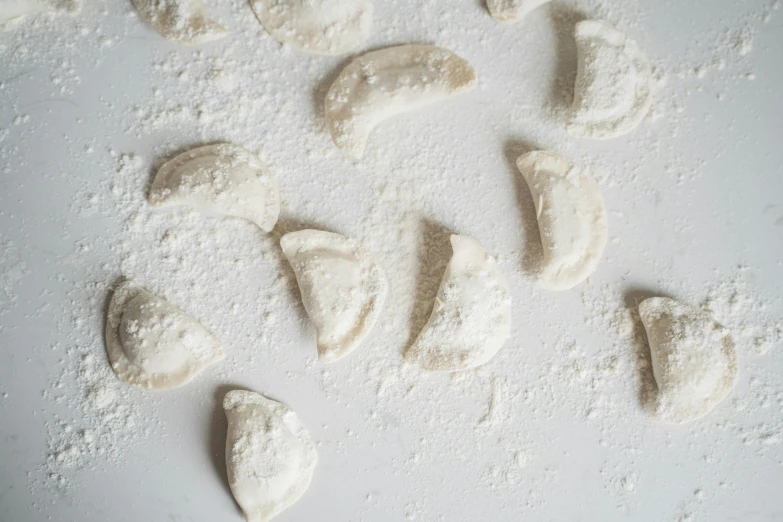 some kind of bread with soing white and is overlaid by tiny cookie cookies