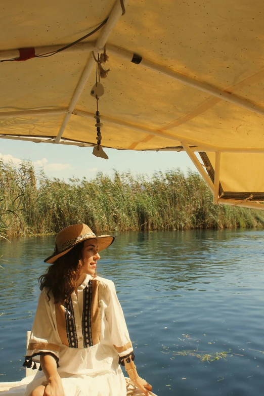 a lady in a boat on the water