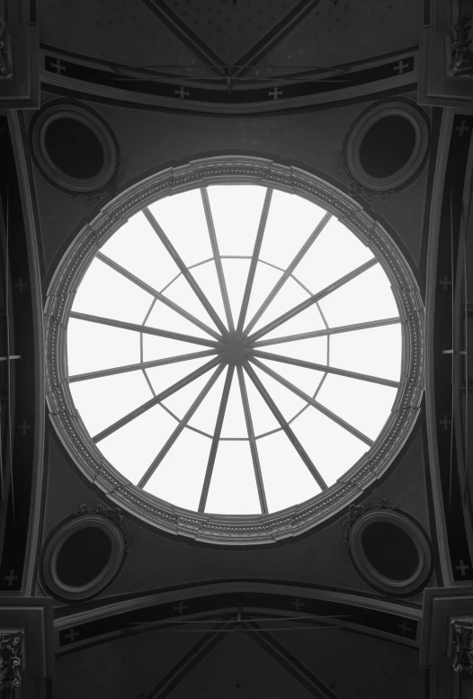 the ceiling and its roof are seen through a circular window