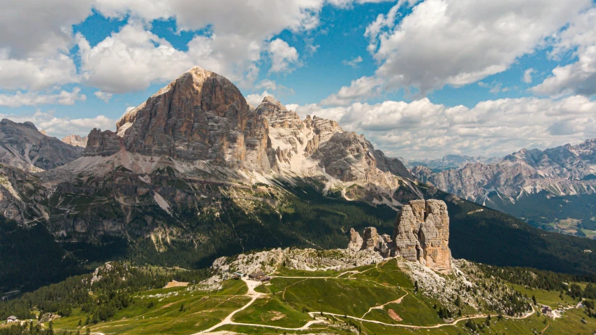 a very tall mountain with many mountains in the background