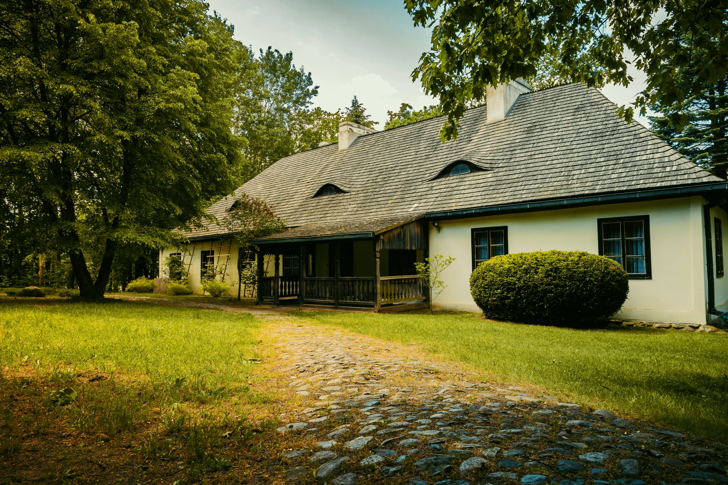 a house with a walkway next to it