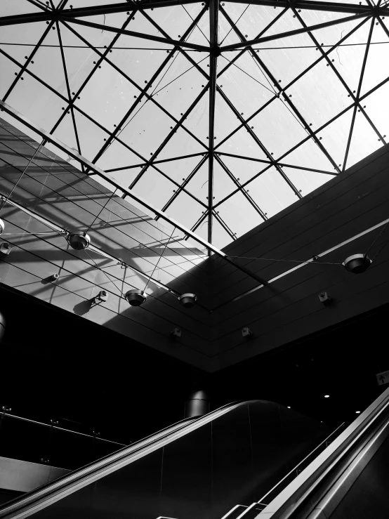 an escalator and two escalators in a modern building