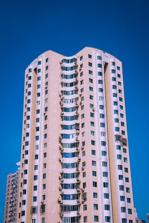 a white and yellow building sitting on top of a sidewalk