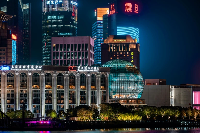 a night view of some very tall buildings