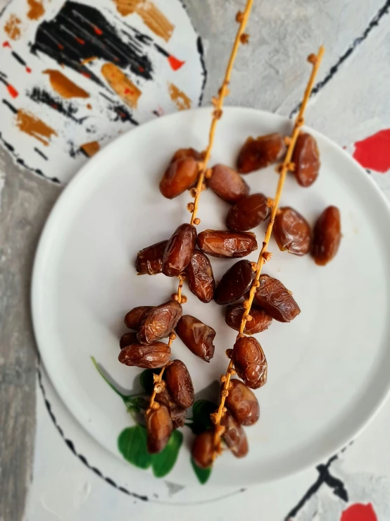 a white plate topped with peanuts and other food items