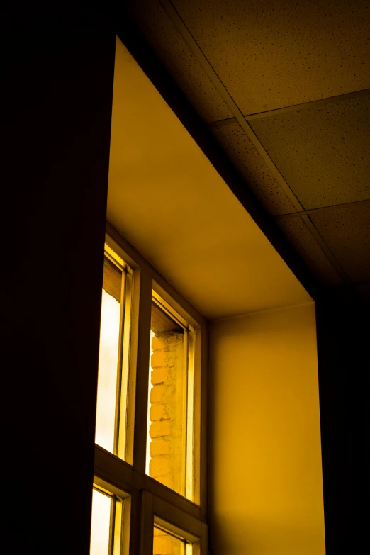 a window on the ceiling, showing light pouring in through