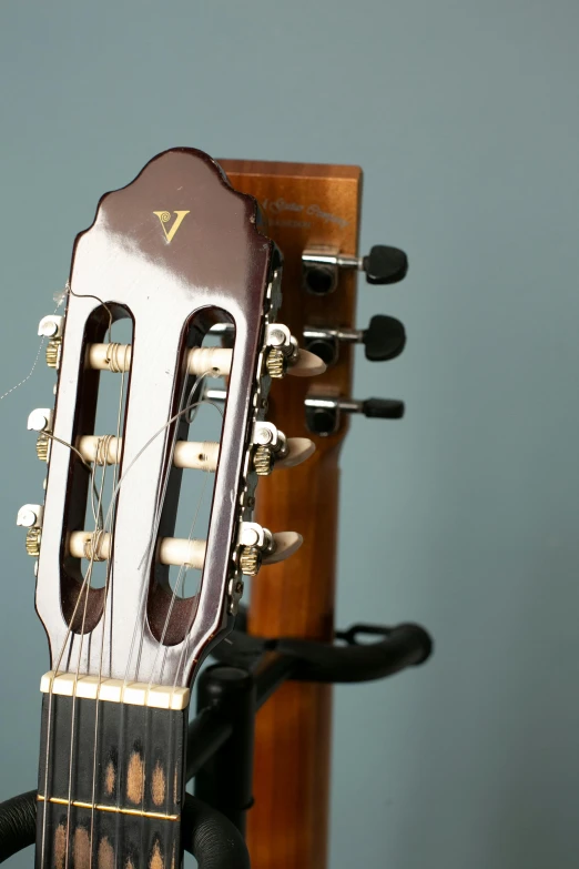 an acoustic guitar being held to a microphone