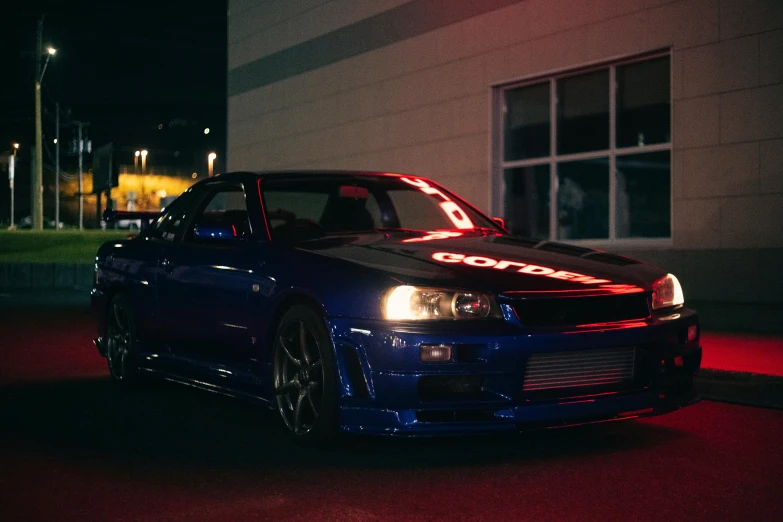 a blue car parked on the side of a street