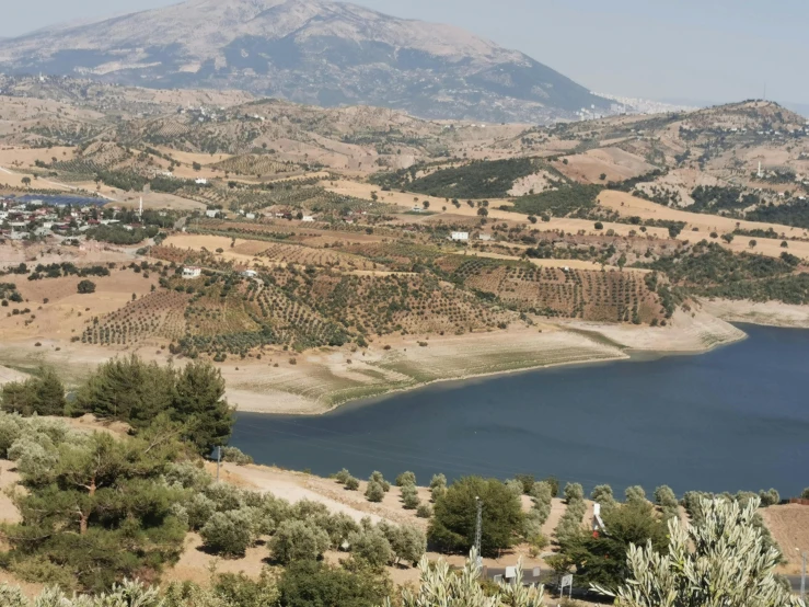 an image of a small lake surrounded by hills