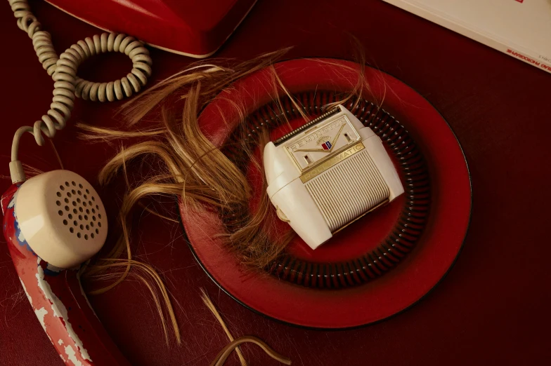 a phone and radio sitting on a plate