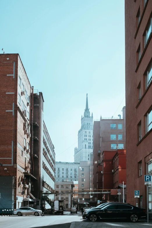 city street intersection with tall buildings in background