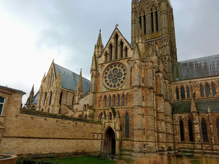 a large cathedral with a large clock on it