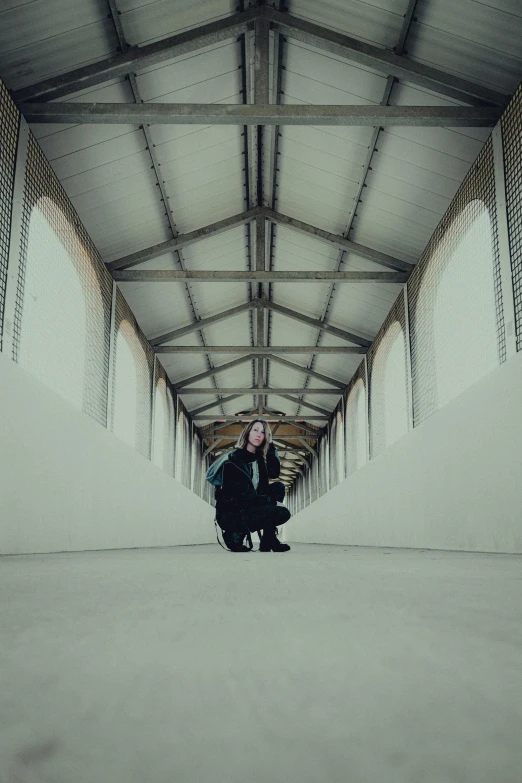 two people sitting in chairs in a warehouse