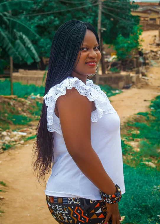 a woman is walking down the road with long hair