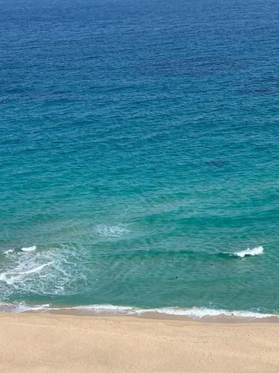 two people riding a board on the water