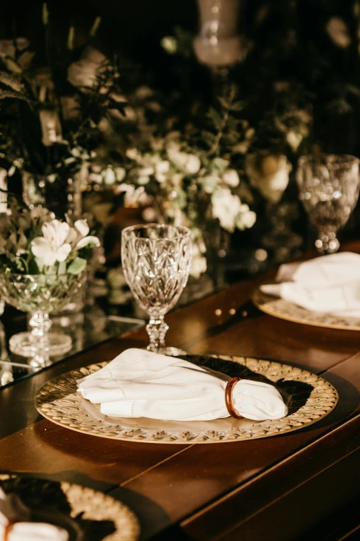 the dining table is set with elegant dishes