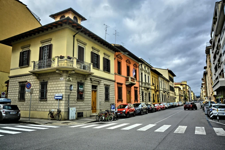 a city street lined with cars and buildings