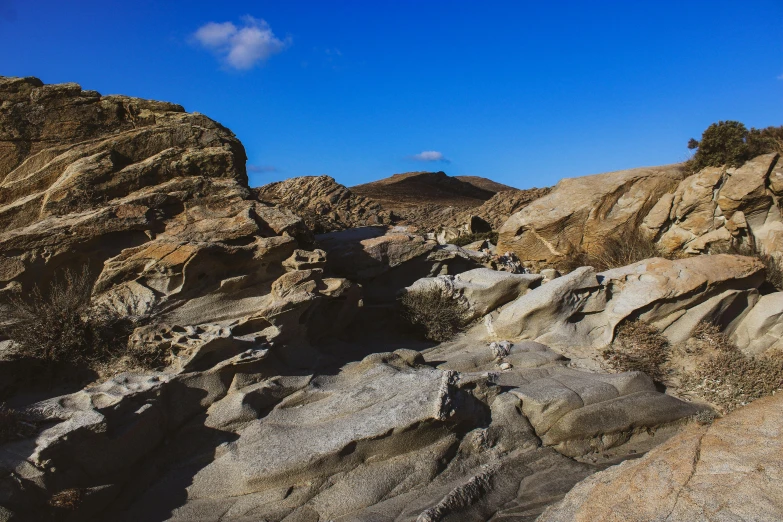 a view of a mountain with rocky terrain