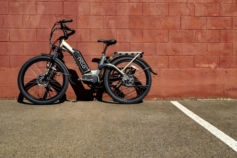 a bike is parked in front of a wall