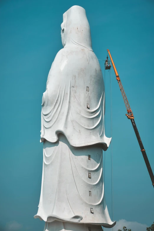 an image of a big buddha statue under construction