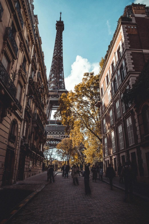 the eiffel tower in the distance, surrounded by buildings