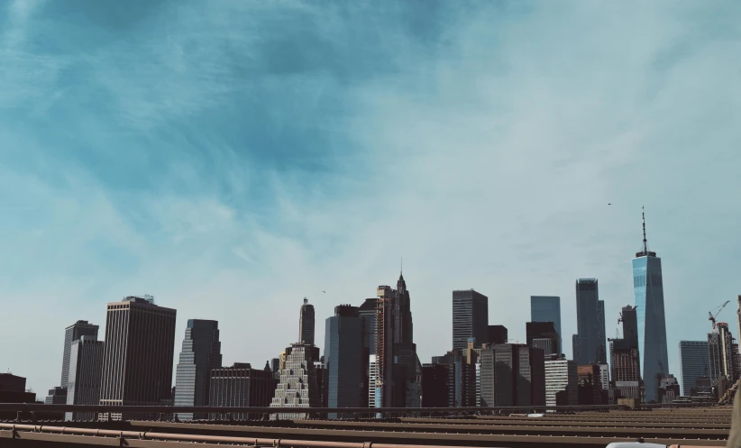 a bridge with a city in the distance